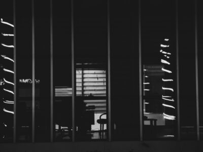 Nighttime reflections on building windows.
