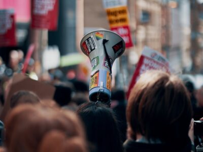 Megaphone held above crowd at a rally or protest