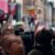 Megaphone held above crowd at a rally or protest