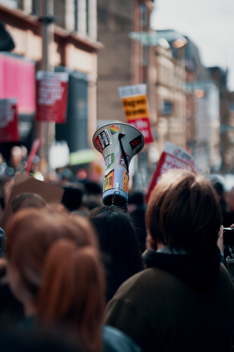 Megaphone held above crowd at a rally or protest