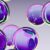 Abstract purple spheres with reflections on gray background
