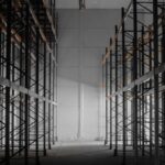 A dark room filled with lots of shelves