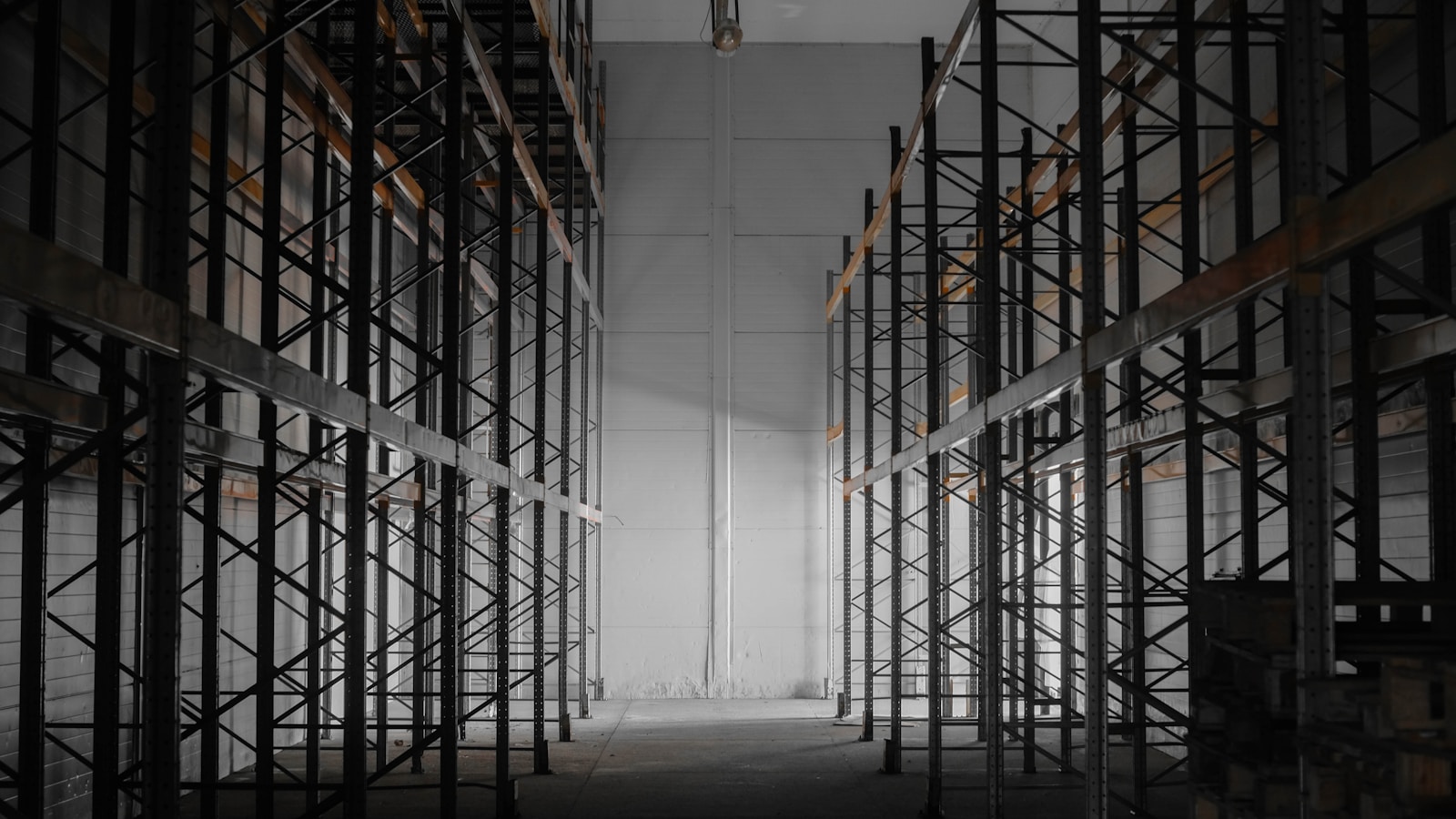 A dark room filled with lots of shelves